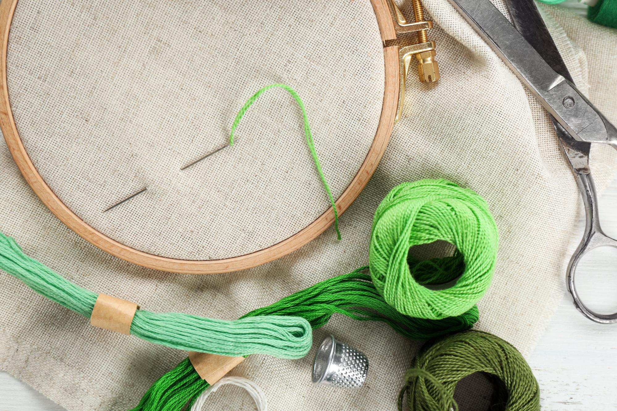 workshop interior with hoop and threads on table